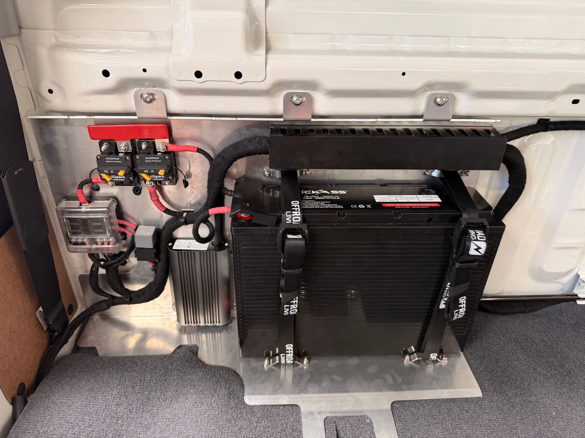 Dual battery system installed behind the rear seats of a LandCruiser