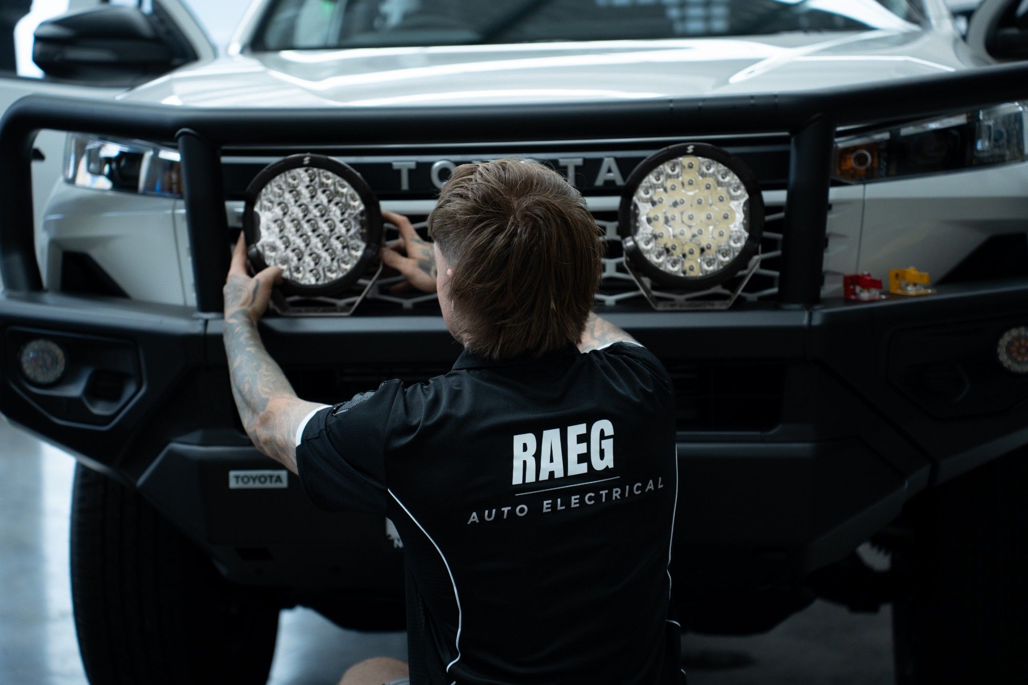 RAEG technician fitting driving lights