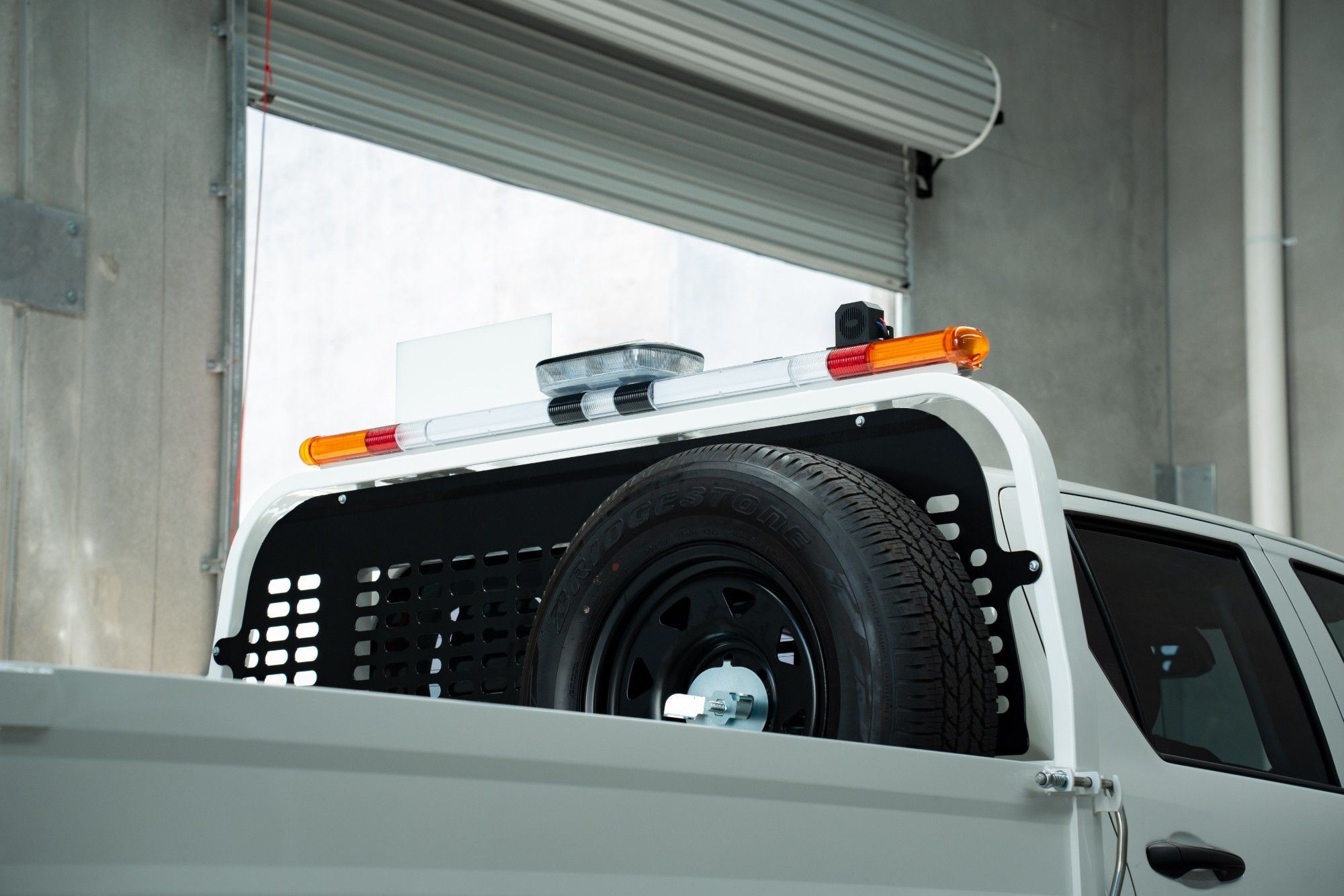 Hilux tray with mine bar and spare wheel carrier